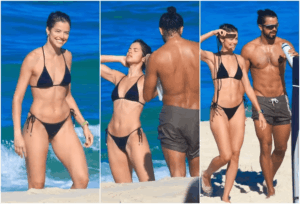 Rodrigo Simas tirando fotos de Agatha Moreira na praia do Rio.